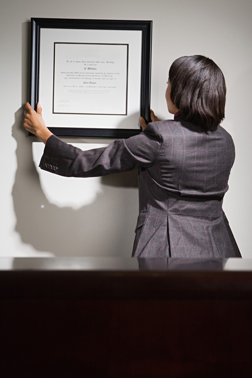 Hanging diplomas on the wall might seem outdated and redundant, but quite a few buyers will consider those dead trees significant.